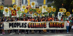 Marchers make their way across Central Park South during the People's Climate March on September 21 2014, in New York. PHOTO/ TIMOTHY A. CLARY/AFP/Getty Images)